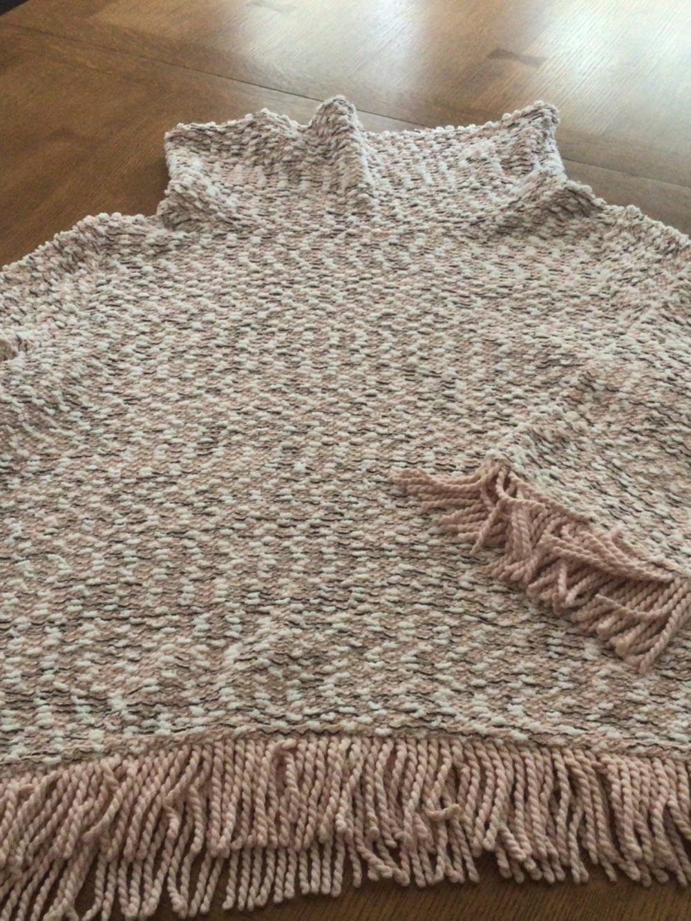 Chunky sweater with fringe detail on bottom and sleeves.  EUC. Size Medium.